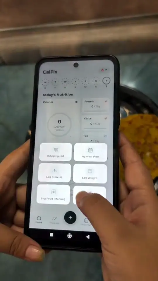 Akansha using the CalFix app to track a meal